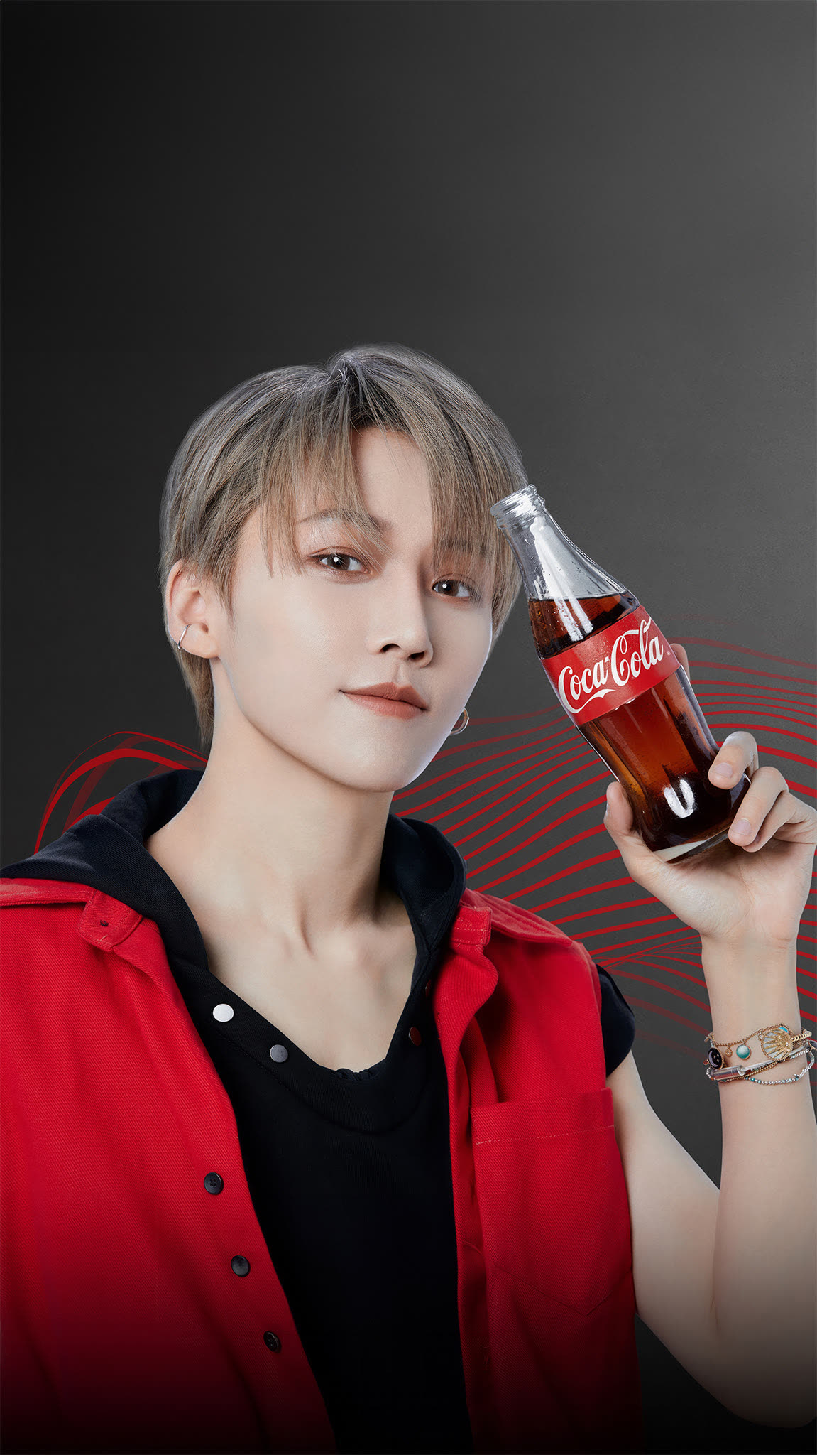 Vibrant photograph of celebrity Liu Xin enjoying a bottle of Coca-Cola, captured by Olivier Hero Dressen as part of the international Coke Studio campaign.